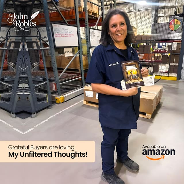 Grateful reader in warehouse holding the book